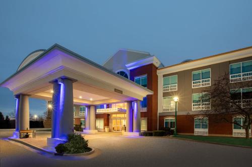 a hospital building with a large building at Holiday Inn Express Hotel & Suites Grand Rapids-North by IHG in Grand Rapids