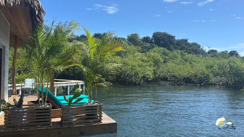 a woman sitting on a raft on a river at CoralBay Bungalows Solarte in Solarte