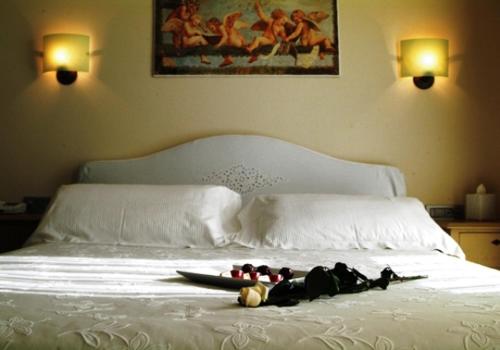 Una cama o camas en una habitación de Hotel Piccolo Principe