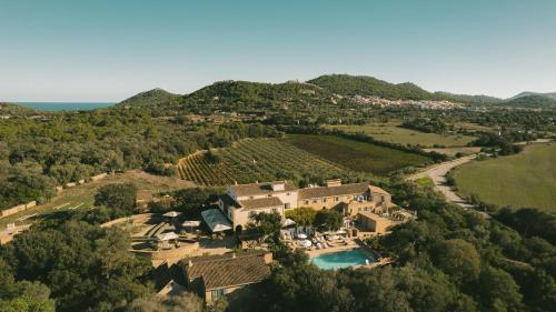 an aerial view of a house in a vineyard at Predi Son Jaumell Hotel Rural in Capdepera