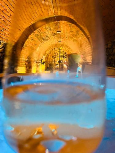 a glass of water in front of a tunnel at Provence Présház in Szederkény