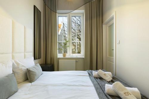 Ένα ή περισσότερα κρεβάτια σε δωμάτιο στο Elite Apartments Aura Old Town