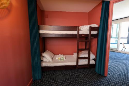 a bunk bed room with two bunk beds in it at Best Western Hotel du Pont Wilson in Lyon