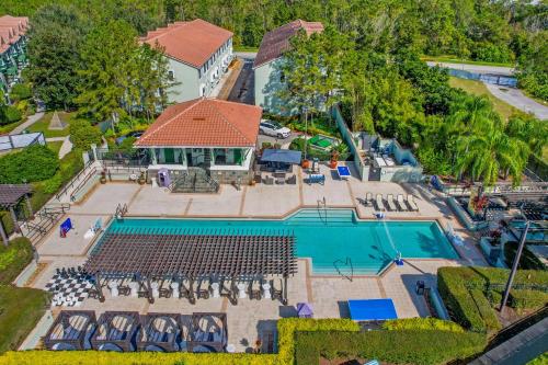 an aerial view of a mansion with a swimming pool at Your Summer Getaway Awaits - Townhome by Disney! in Orlando