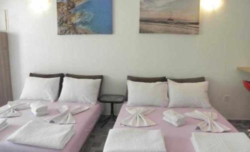 En eller flere senge i et værelse på Apartments Masa