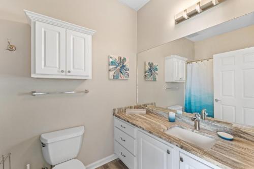 a bathroom with a sink and a toilet at Inn at Seacrest 309- Somewhere in the Sun in Inlet Beach