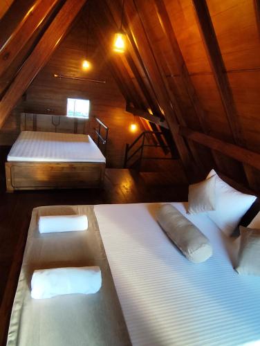 a bedroom with two beds in a attic at Miracle view Ella in Ella