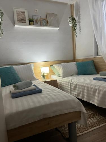 a bedroom with two beds with towels on them at MARIS MOBILE HOME in Drage