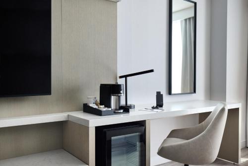 a room with a desk with a chair and a mirror at Hyatt Regency Chicago in Chicago