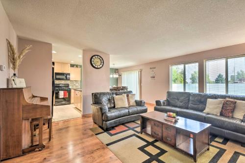 a living room with a couch and a piano at Welcoming Medford Home Near Parks and Downtown! in Medford