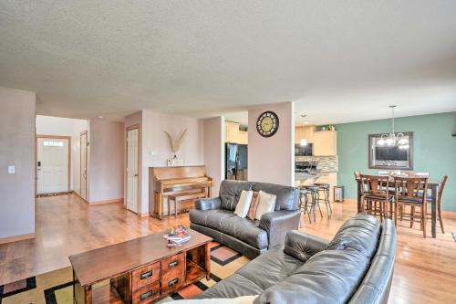 a living room with a couch and a table at Welcoming Medford Home Near Parks and Downtown! in Medford