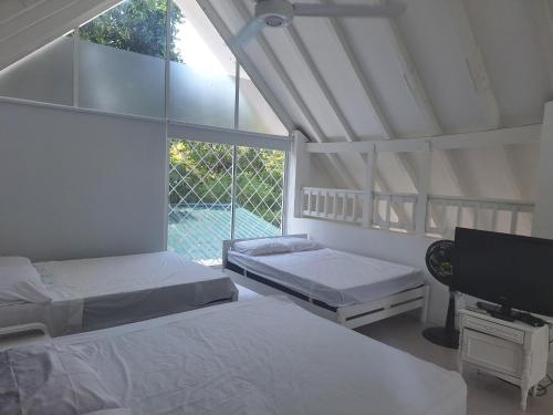Postel nebo postele na pokoji v ubytování San Marcos Villa Mesa