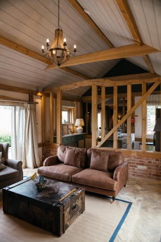 a living room with a couch and a coffee table at Retreat East in Ipswich