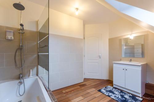 a bathroom with a shower and a sink and a tub at Le terminus in Villenauxe-la-Grande