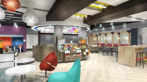 a lobby of a store with tables and chairs at Tru By Hilton Huntsville Research Park Area in Huntsville