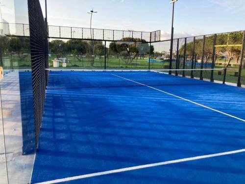 a tennis court with a net on it at Casa Tartaruga in SantʼAntìoco