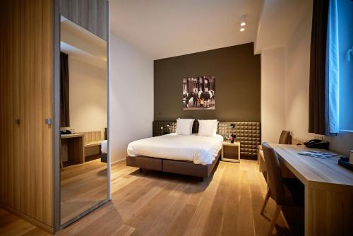 Postel nebo postele na pokoji v ubytování Mercure Roeselare