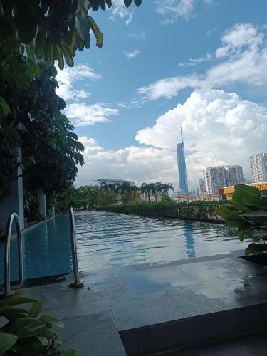 a swimming pool with a city in the background at Trion KL Residence by Skyline in Kuala Lumpur