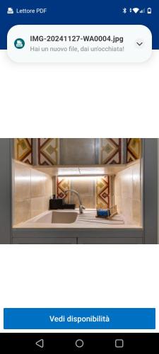a picture of a kitchen with a sink at Casa in stile in Pezze di Greco