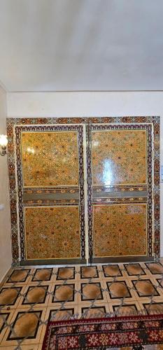 a room with a wall covered in ornamental tiles at Ryad 91 in Casablanca
