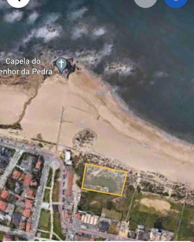 an aerial view of the beach at Green Dunes House in Arcozelo