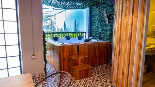a room with a sink with plants on the wall at Urban Oasis Med in Medellín
