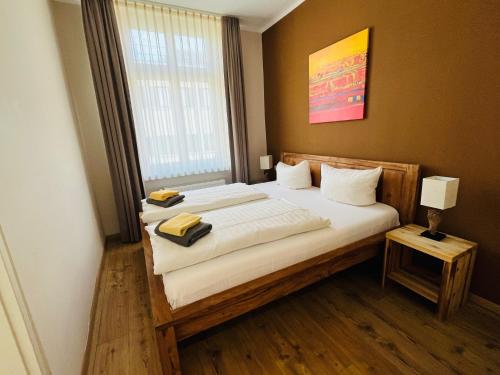Ένα ή περισσότερα κρεβάτια σε δωμάτιο στο Apartment Central Leipzig - Zoo