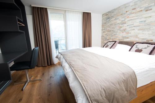 Hotel Roggerliにあるベッド