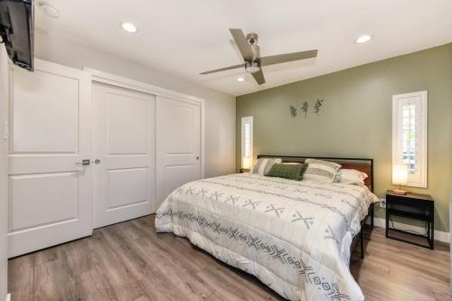 a bedroom with a bed and a ceiling fan at Charming Home, near beautiful park and tennis courts! in Roseville