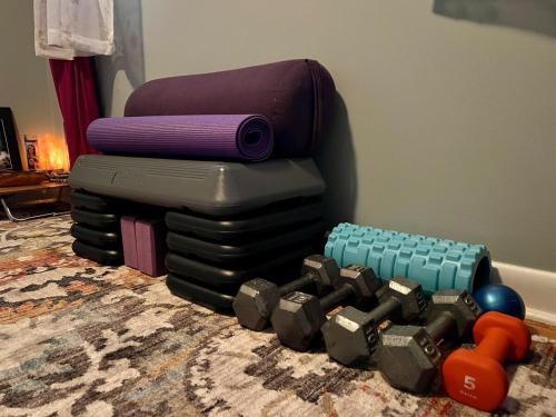 a stack of mattresses sitting on the floor with a toy at Happy Haven w hottub, Gym, & hammocks in West AVL in Asheville