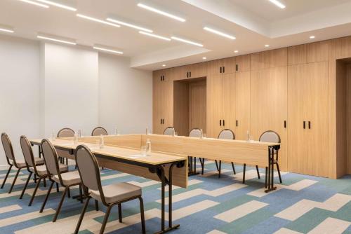 a large conference room with a long table and chairs at Radisson Hotel & Residence Riyadh Olaya in Riyadh