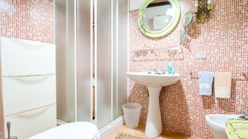 a bathroom with a sink and a mirror at TUSCAN RUSTIC HOUSE - with Garden, Wi-Fi in Cireglio
