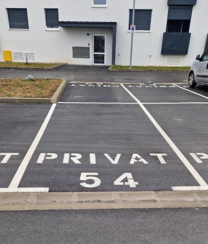 an empty parking lot with the words parental at ONNE Apartment in Zaprešić