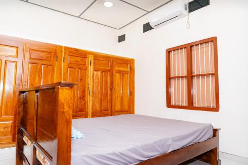 Postel nebo postele na pokoji v ubytování Bhavany Home
