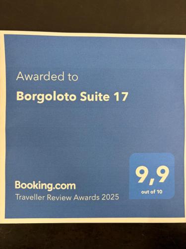 a blue sign that says awarded to bergdorffitte at Borgoloto Suite 17 in San Marino