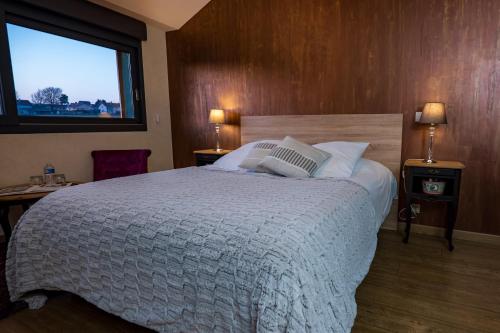 Ένα ή περισσότερα κρεβάτια σε δωμάτιο στο Appartement cosy et chaleureux