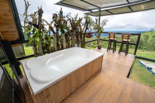 a large bath tub in a room with a view at Kavas Natural Connection in Salento