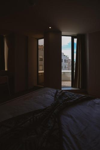 Postel nebo postele na pokoji v ubytování 888 Hostel&Suites