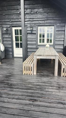 a wooden bench sitting on the inside of a cabin at Hytte i Myrkdalen in Helgatun