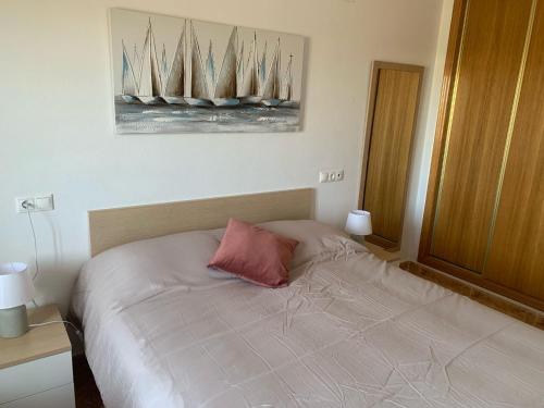 En eller flere senge i et værelse på Lodosol Raúl