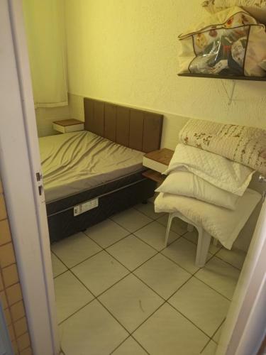 Postel nebo postele na pokoji v ubytování Flat Aconchegante na Praia das Conchas