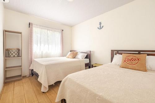 En eller flere senge i et værelse på Villa Congo 6 near the peñon guacalillo