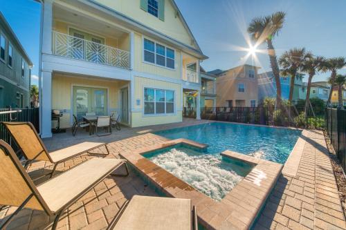 a swimming pool in the backyard of a house at Margaritaville Cottages Orlando with H2O Waterpark by Rentyl in Kissimmee