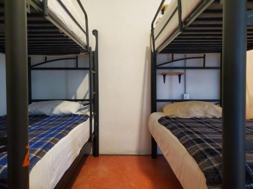 Postel nebo postele na pokoji v ubytování Anamaya Hostal