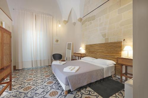 Postel nebo postele na pokoji v ubytování Palazzo Circolone