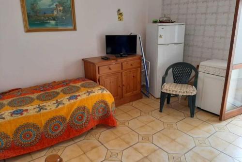 Katil atau katil-katil dalam bilik di Casa vacanze con vista mare