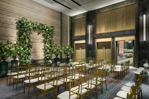a banquet hall with tables and chairs in a building at The St. Regis Hong Kong in Hong Kong