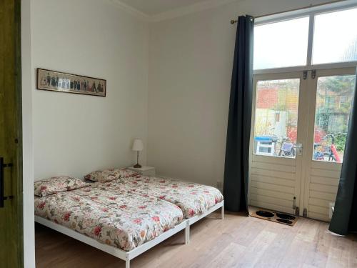 Postel nebo postele na pokoji v ubytování Achterom B & B