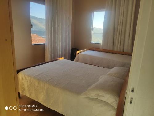 En eller flere senge i et værelse på CASA ACONCHEGANTE