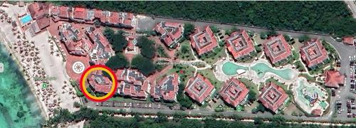 an overhead view of a property with a yellow circle at 2BR Beachfront Cadaques Caribe in Bayahibe
